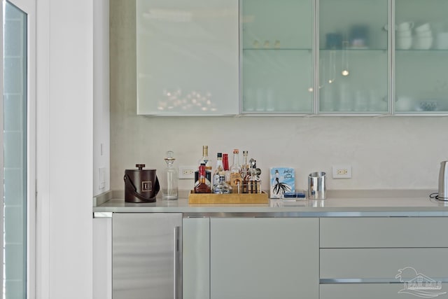 bar with stainless steel refrigerator