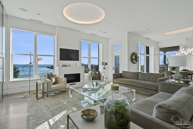 living room with a chandelier and a wealth of natural light