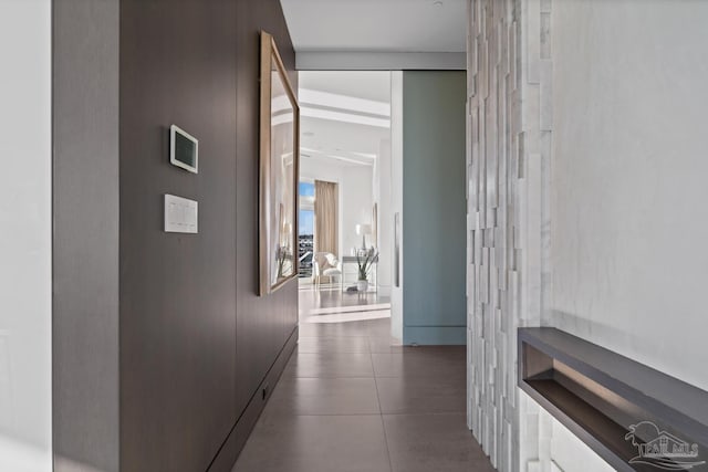 corridor with dark tile patterned flooring