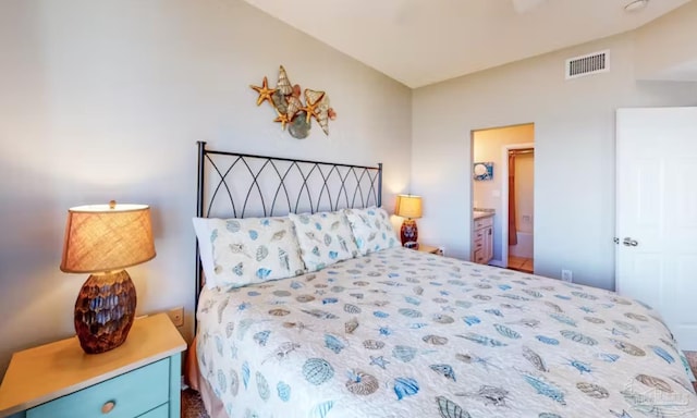 bedroom with visible vents and ensuite bath