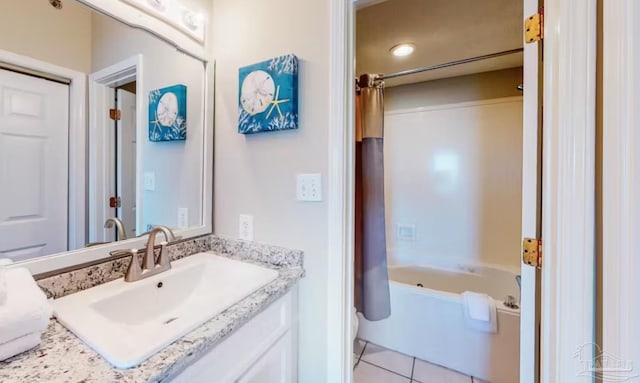 bathroom featuring shower / bath combo, tile patterned flooring, and vanity