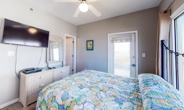 carpeted bedroom with a ceiling fan and baseboards