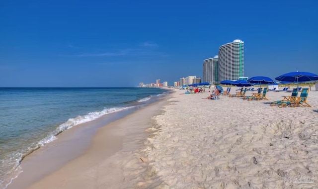 view of water feature with a view of the beach and a city view