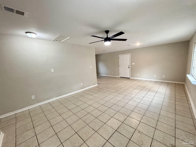 unfurnished room featuring ceiling fan and light tile patterned floors