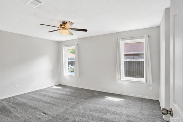 2252 Valle Escondido Dr, Pensacola, FL 32526 - empty room featuring carpet flooring, visible vents, ceiling fan, and baseboards