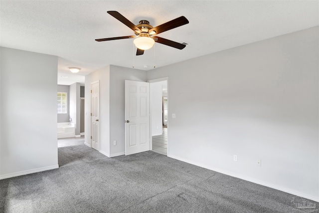 2252 Valle Escondido Dr, Pensacola, FL 32526 - unfurnished bedroom with baseboards, a ceiling fan, carpet floors, and ensuite bathroom