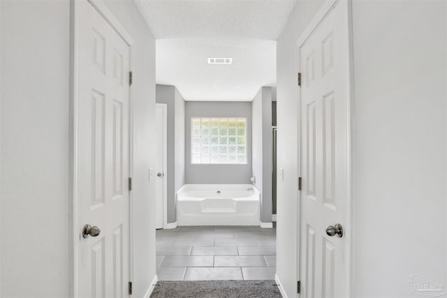 2252 Valle Escondido Dr, Pensacola, FL 32526 - corridor featuring visible vents and baseboards