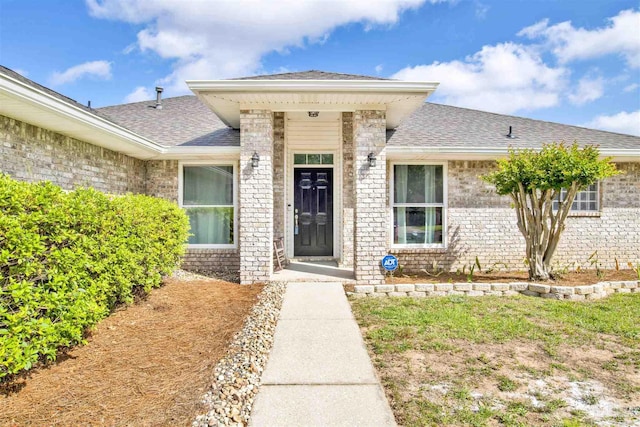 2252 Valle Escondido Dr, Pensacola, FL 32526 - doorway to property featuring brick siding and a shingled roof