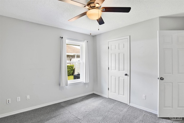 2252 Valle Escondido Dr, Pensacola, FL 32526 - unfurnished bedroom featuring a textured ceiling, ceiling fan, carpet, and baseboards