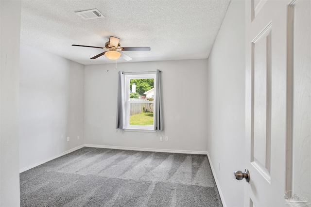 2252 Valle Escondido Dr, Pensacola, FL 32526 - spare room featuring carpet flooring, baseboards, visible vents, a ceiling fan, and a textured ceiling