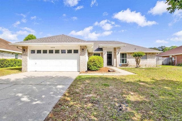 2252 Valle Escondido Dr, Pensacola, FL 32526 - single story home with concrete driveway, a front yard, an attached garage, and brick siding