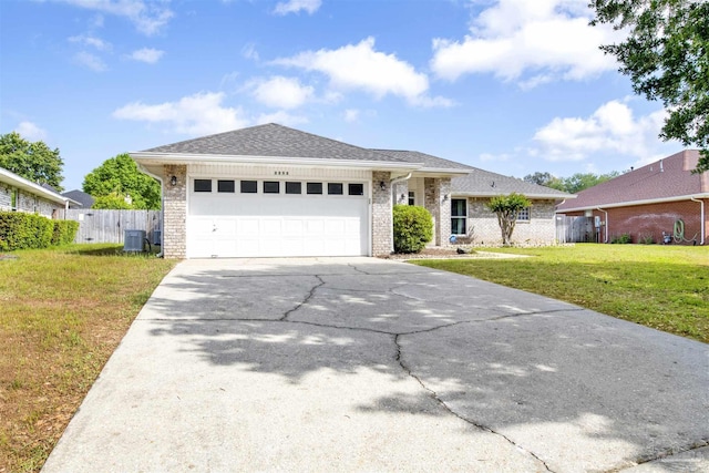 2252 Valle Escondido Dr, Pensacola, FL 32526 - ranch-style house with fence, driveway, cooling unit, a front yard, and an attached garage