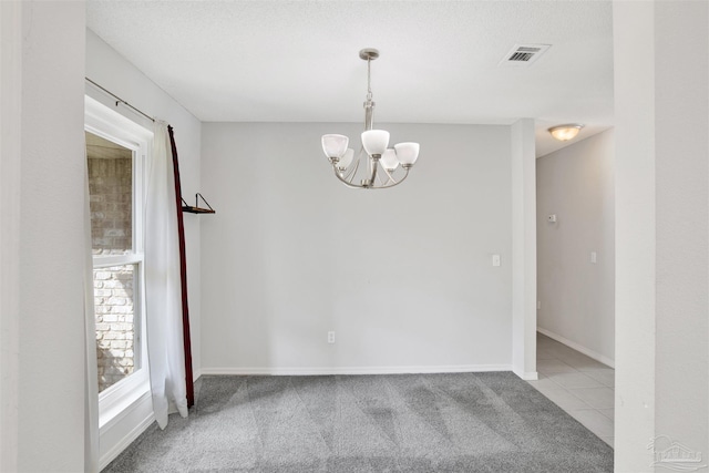 2252 Valle Escondido Dr, Pensacola, FL 32526 - tiled empty room with baseboards, visible vents, an inviting chandelier, and carpet