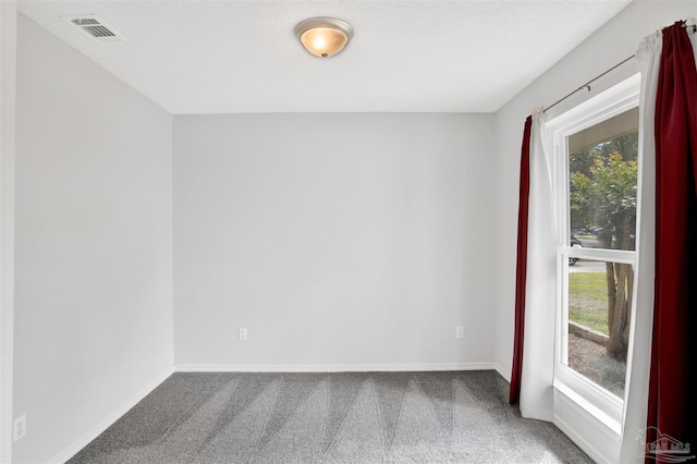 2252 Valle Escondido Dr, Pensacola, FL 32526 - unfurnished room with visible vents, carpet, and baseboards