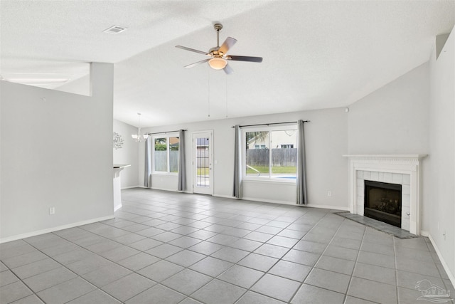 2252 Valle Escondido Dr, Pensacola, FL 32526 - unfurnished living room featuring visible vents, vaulted ceiling, tile patterned floors, and a fireplace