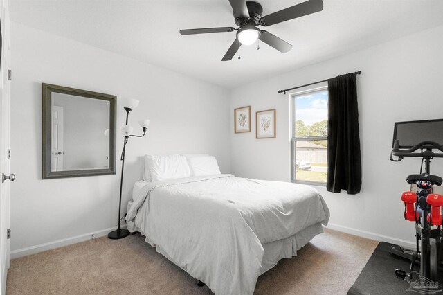 8743 Schooner Ln, Pensacola, FL 32507 - bedroom featuring carpet flooring, baseboards, and ceiling fan
