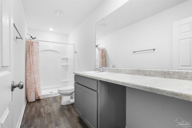 8743 Schooner Ln, Pensacola, FL 32507 - full bathroom with a stall shower, toilet, wood finished floors, and vanity