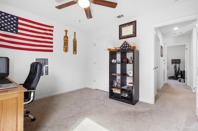 8743 Schooner Ln, Pensacola, FL 32507 - home office with a ceiling fan, carpet, baseboards, and visible vents