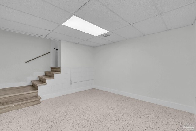 unfurnished room featuring a paneled ceiling