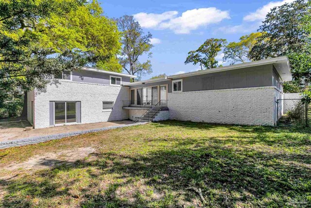 back of property featuring a patio area