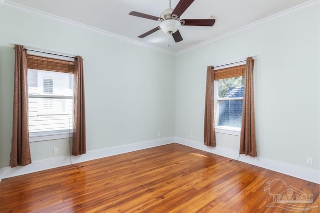 unfurnished room featuring ceiling fan, baseboards, wood finished floors, and crown molding