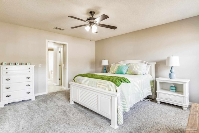 bedroom with light carpet, a textured ceiling, and ceiling fan