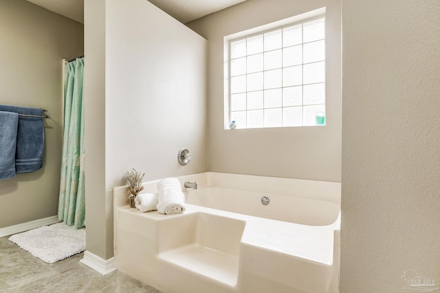 bathroom featuring a bath