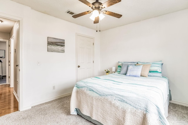 carpeted bedroom with ceiling fan