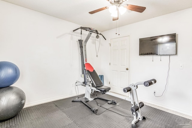 exercise room with ceiling fan