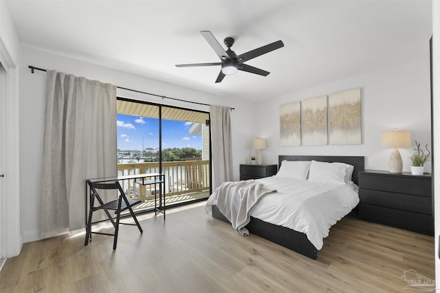 bedroom featuring ceiling fan, wood-type flooring, and access to outside