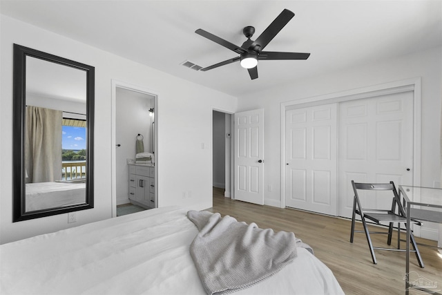 bedroom with ceiling fan, a closet, connected bathroom, and light hardwood / wood-style flooring