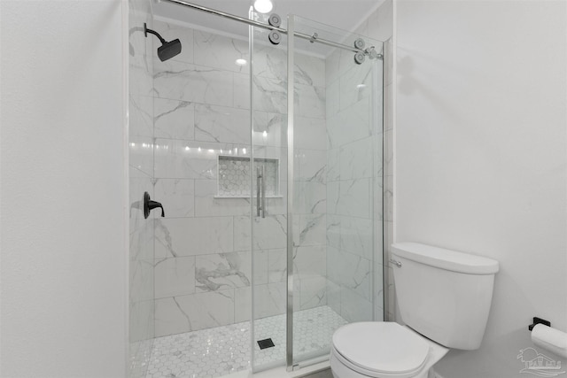 bathroom with walk in shower and toilet