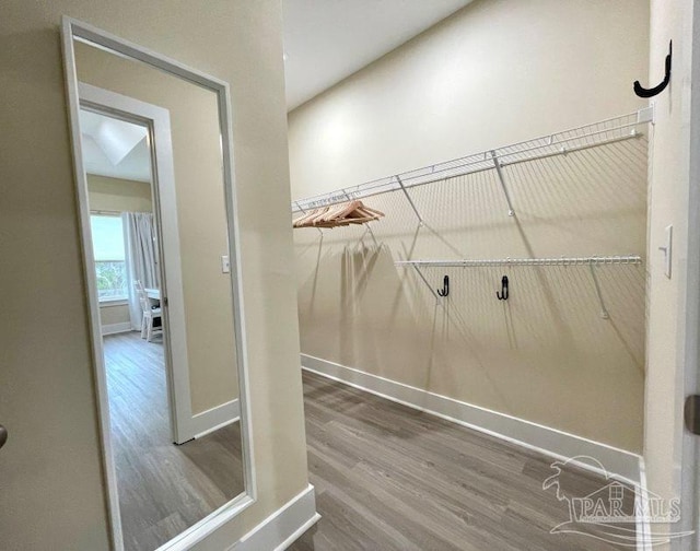 laundry room with hardwood / wood-style floors