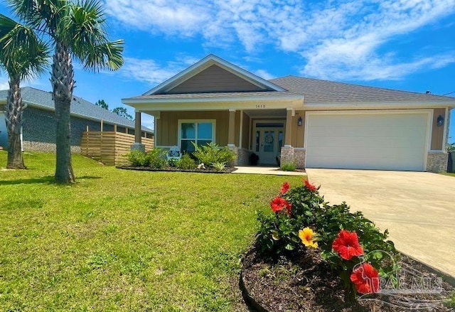 view of front of house featuring a garage and a front yard