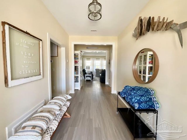 hallway featuring wood-type flooring