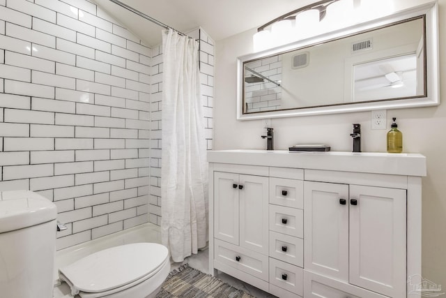 bathroom featuring vanity, vaulted ceiling, toilet, and walk in shower