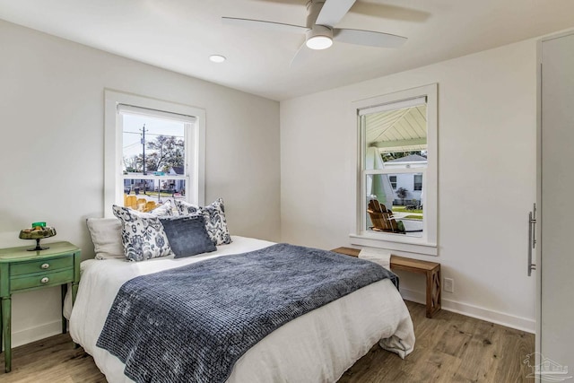 bedroom featuring ceiling fan and light hardwood / wood-style floors