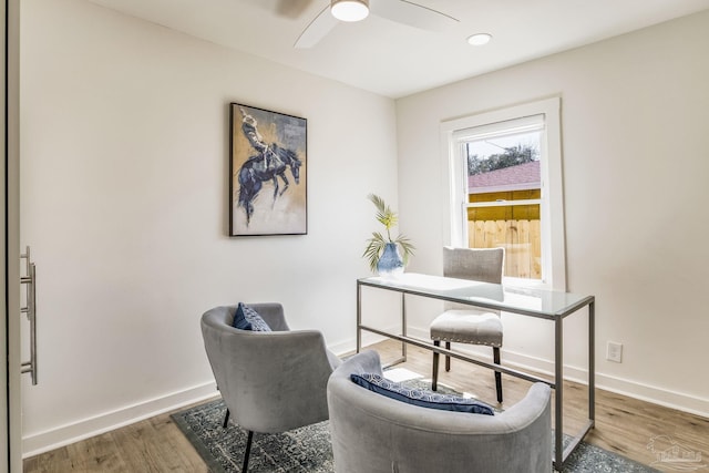 office featuring dark hardwood / wood-style floors and ceiling fan