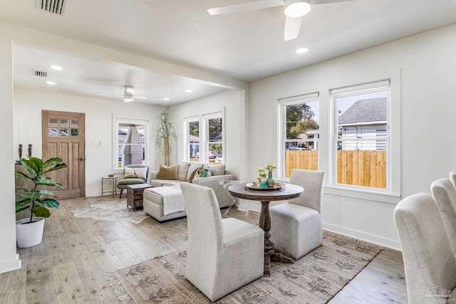 dining area featuring light hardwood / wood-style flooring and ceiling fan