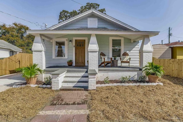 bungalow-style house featuring covered porch