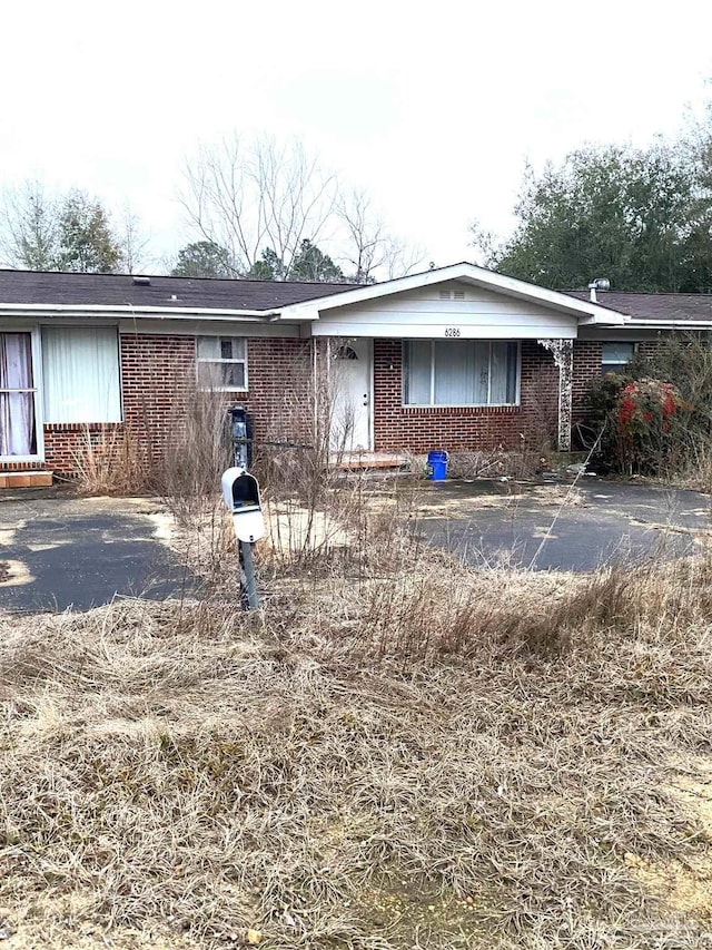 single story home with brick siding