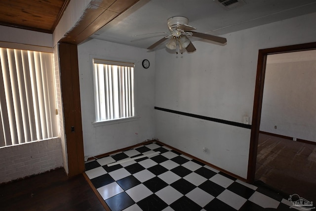 unfurnished room with visible vents, a ceiling fan, and tile patterned floors