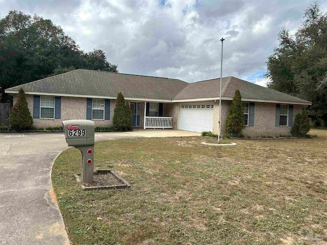 single story home with a front yard, a porch, and a garage