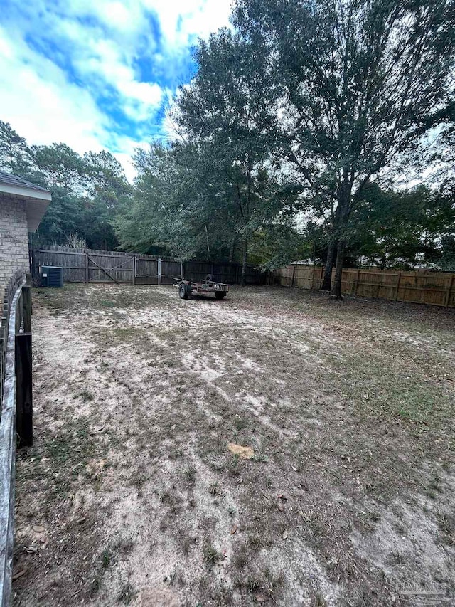 view of yard featuring central air condition unit