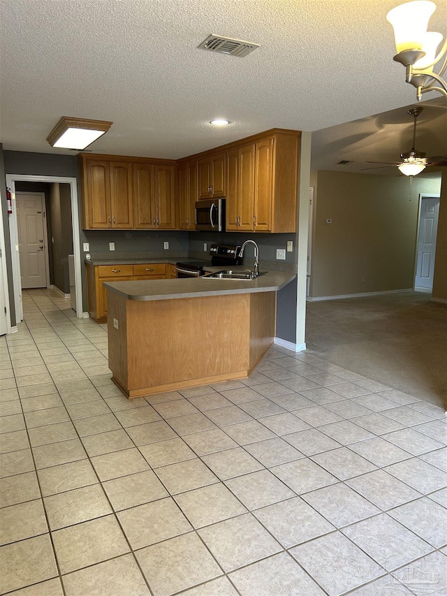 kitchen featuring sink, black electric range, ceiling fan, light tile patterned floors, and kitchen peninsula