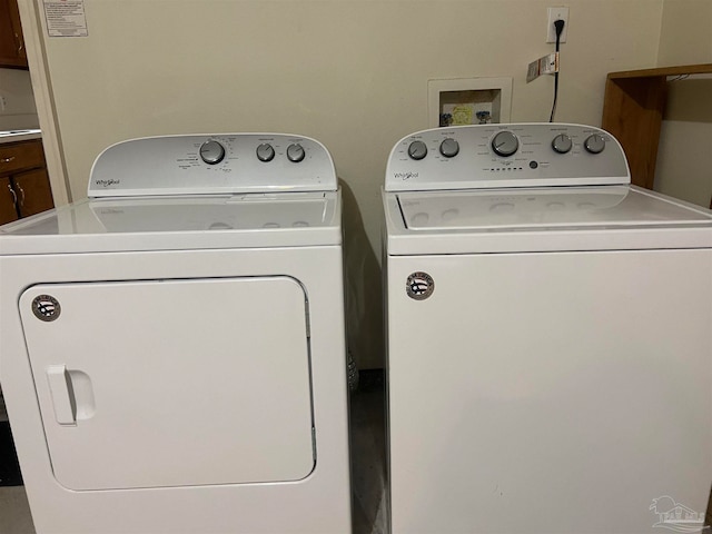 washroom with washer and clothes dryer