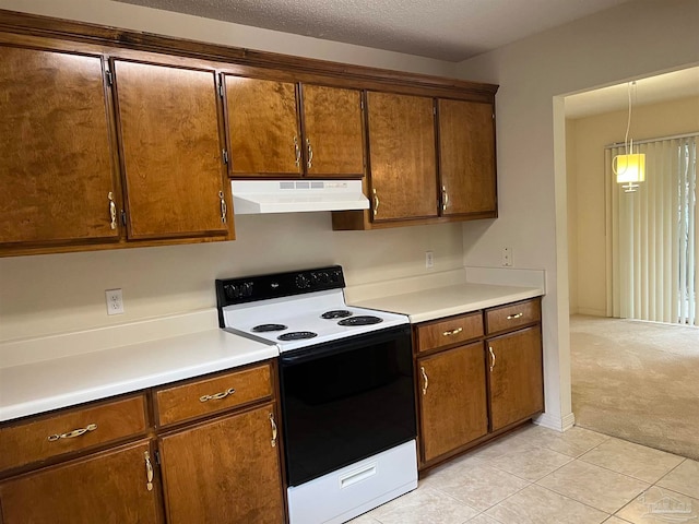 kitchen with a textured ceiling, decorative light fixtures, white electric stove, and light carpet