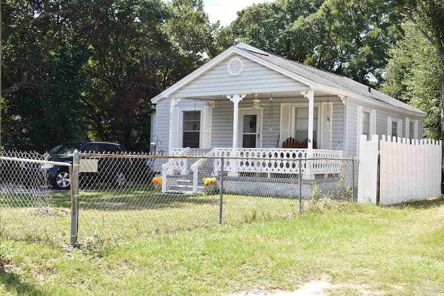 view of front of home featuring covered porch and a front yard