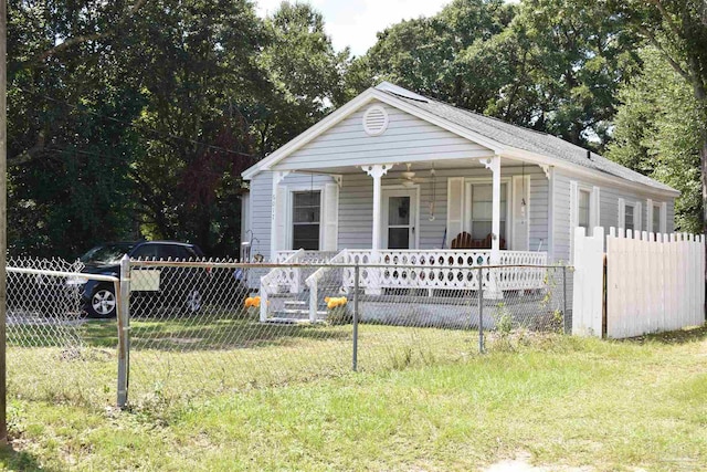 view of front of house with a front lawn and a porch