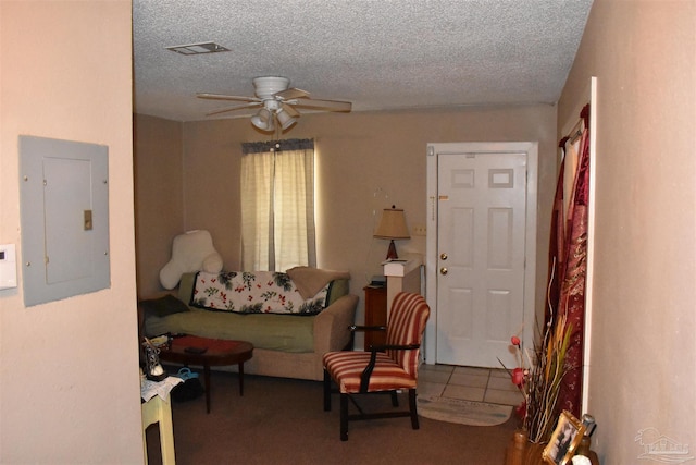 6017 Montgomery Ave, Pensacola, FL 32526 - living room with electric panel, carpet floors, a textured ceiling, and ceiling fan